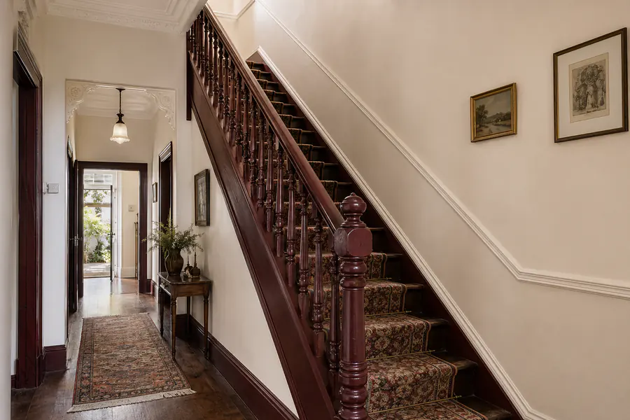 Freshly painted heritage residential staircase and hallway